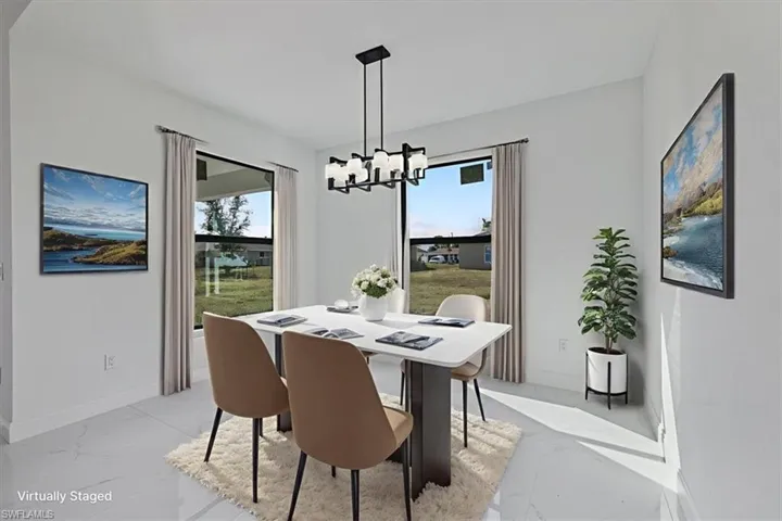 Dining space with baseboards and a chandelier