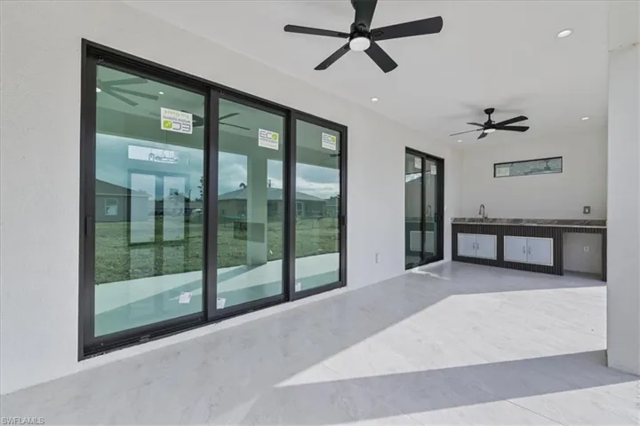 View of patio featuring a ceiling fan
