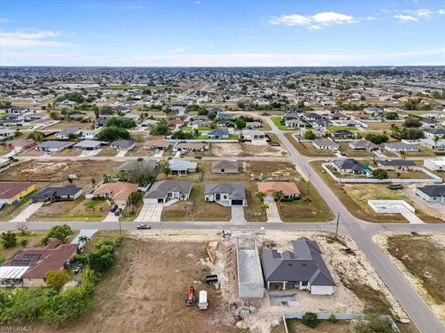 Aerial overview of property's location with nearby suburban area