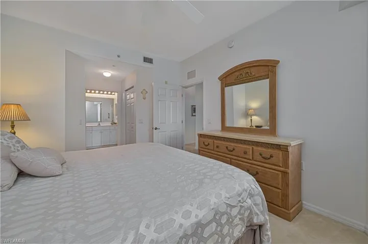 As in the rest of the unit, the furniture in the primary bedroom has been well-maintained.