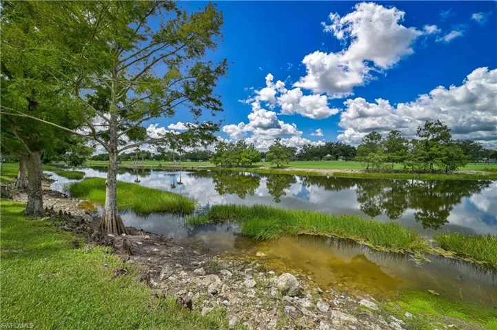 From the covered balcony, the owner(s) have a unique vantage point to the beauty of the lake and golf course.