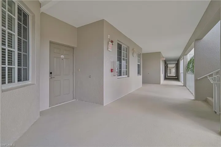 The front door has a keypad security lock and is directly across from the stairs.