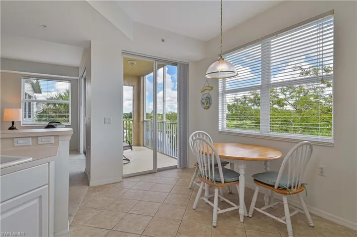 Enjoy the outdoor scenery while having breakfast from the cozy kitchen table and chairs.