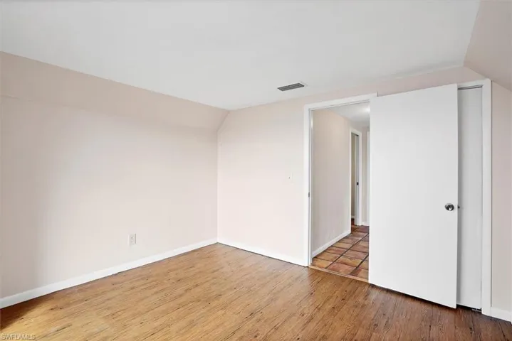 Empty room with  light wood finished floors