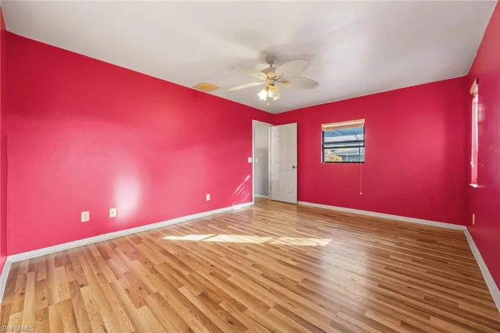 Unfurnished bedroom with wood finished floors and ceiling fan