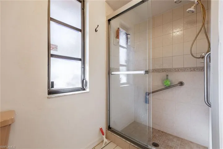 Bathroom featuring a shower stall