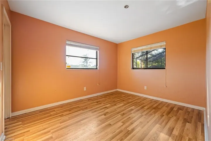 Unfurnished room featuring light wood-style floors and plenty of natural light