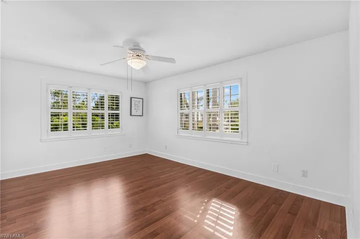 View of swimming pool with a ceiling fan, french doors, and a wooden deck