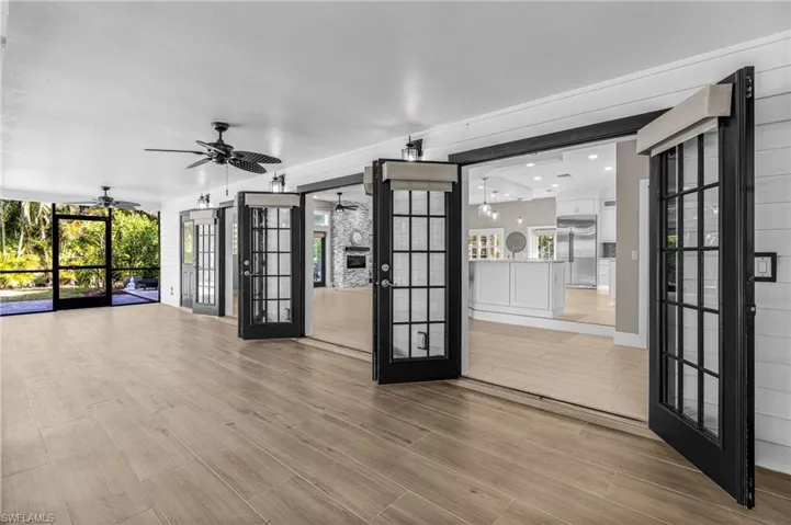 Empty room featuring french doors, recessed lighting, ceiling fan, and light wood finished floors