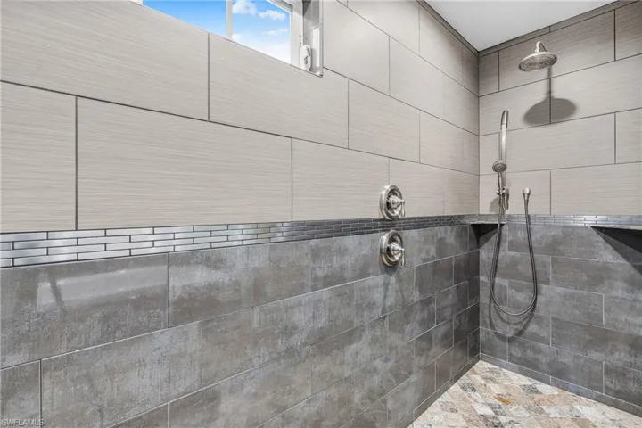 Swimming pool with ceiling fan and a patio area