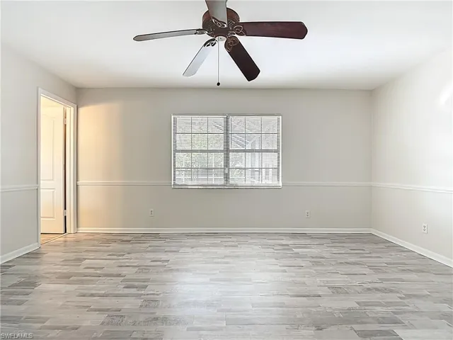 Spare room with light wood-style flooring and ceiling fan