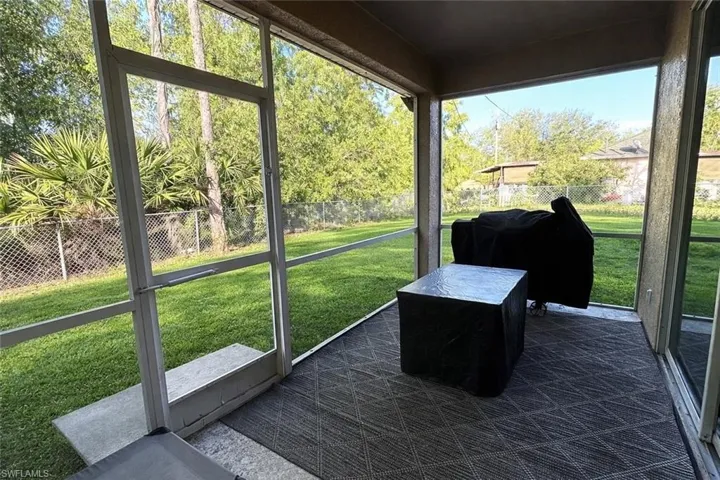 View of sunroom, grass is enhanced