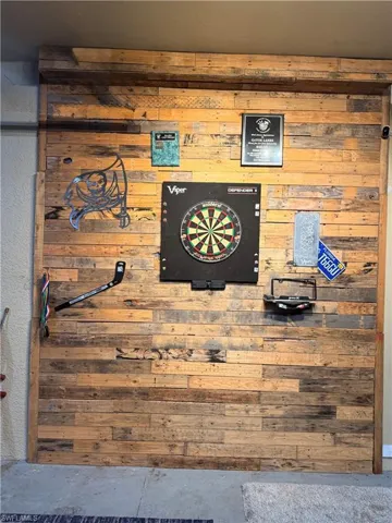 Detailed view of concrete flooring and wooden walls
