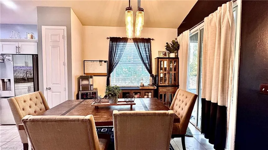 Dining area featuring light tile patterned floors