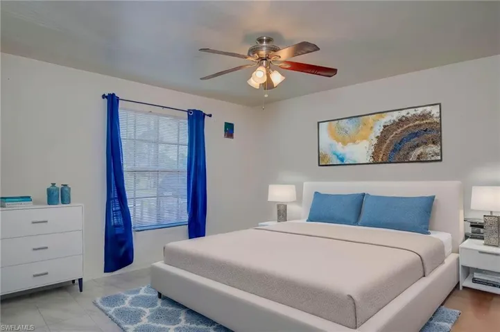 Bedroom featuring a ceiling fan ai modified furniture