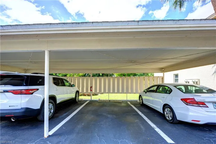 Covered parking lot with fence