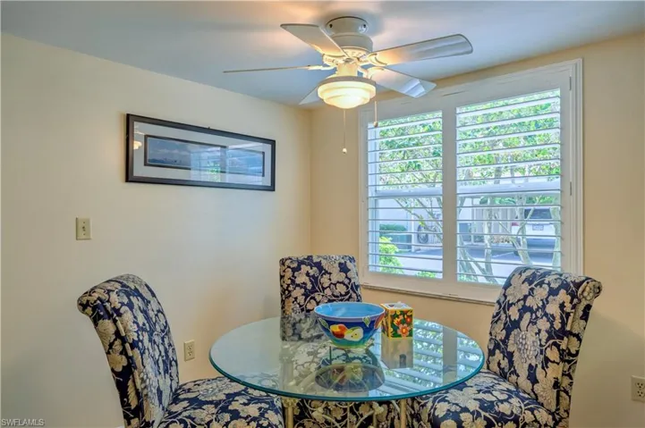 Dining space featuring a ceiling fan and plenty of natural light