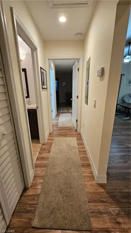 Wood-finish flooring throughout, complemented by light-toned wall paint and white trim