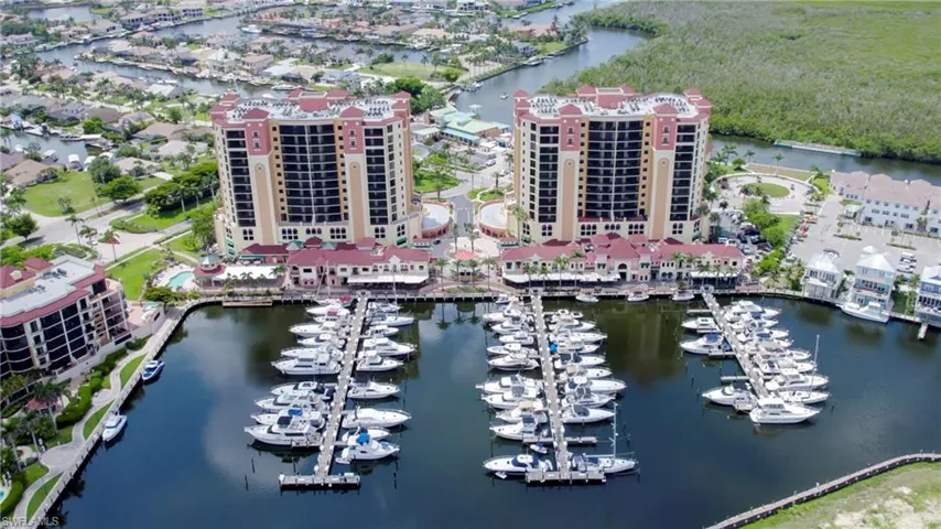 Cape Harbour Marina located inside community with restaurants and shops and newly opened 'Chiquita Pass' to right of condo tower opposite circular drive. Marina has direct sailboat access out to open water with wet slips, boat house dry storage, pump-out services, and marine fuel.