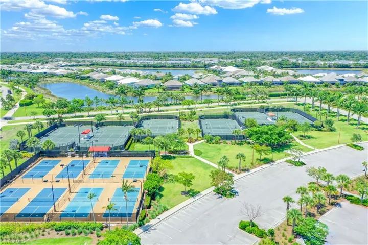 Aerial perspective of suburban area featuring a large body of water