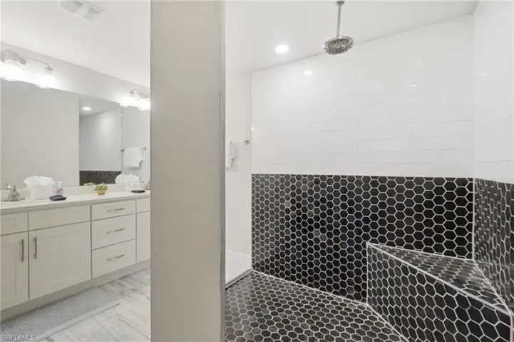 Spacious Rainshower  with black hexagonal tiling