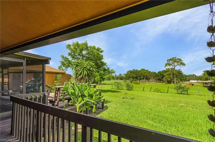View of yard with a sunroom