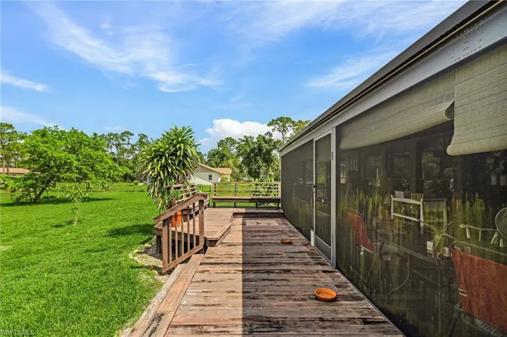 Wooden deck with a yard