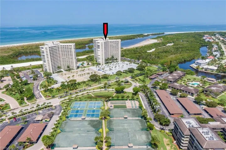 Aerial overview of property's location with a large body of water