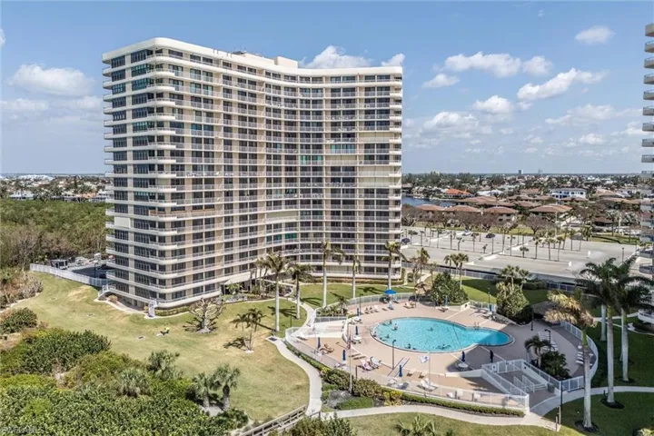 View of apartment building / complex featuring a community pool