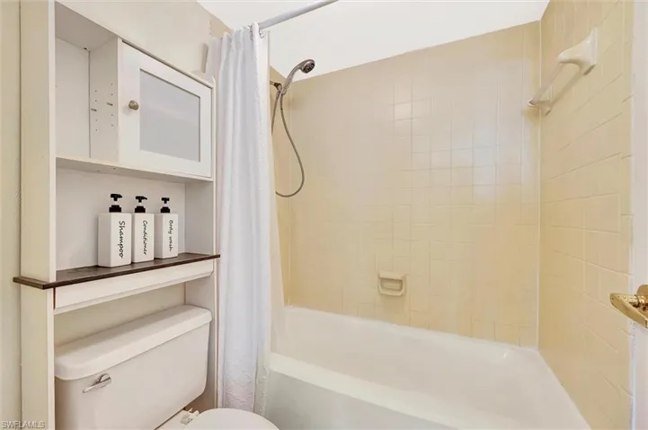 Bathroom with toilet and shower / tub combo