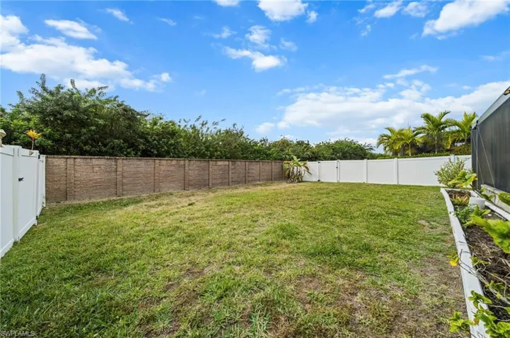 View of fenced backyard