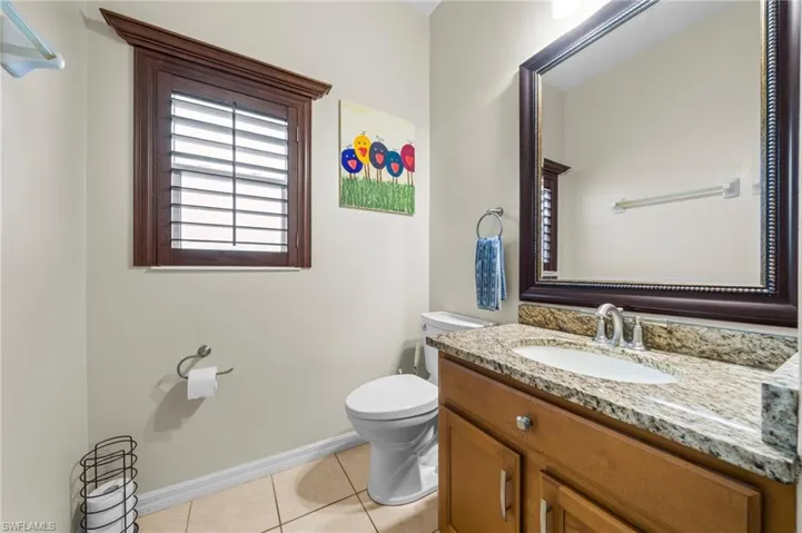 Bathroom featuring vanity and light tile patterned flooring