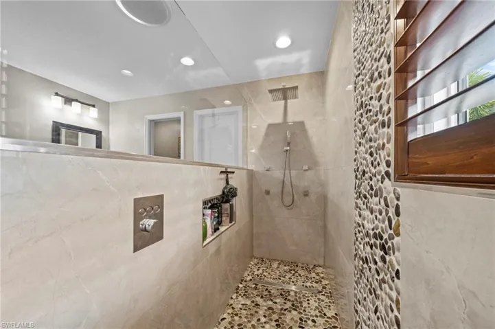 Bathroom featuring walk in shower