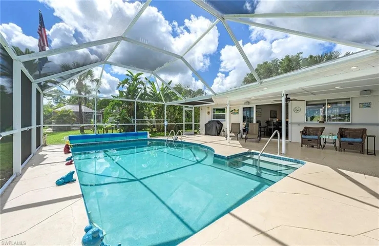 View of pool with a patio and a lanai