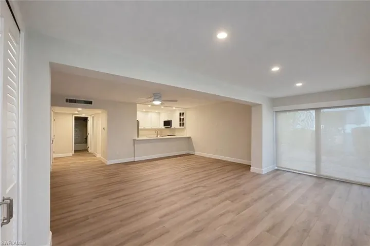 Unfurnished living room featuring recessed lighting, light wood-style floors, and a ceiling fan