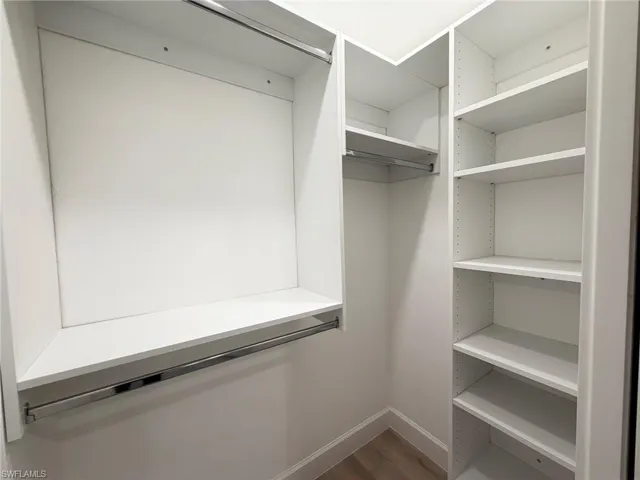 Walk in closet featuring light wood-style flooring