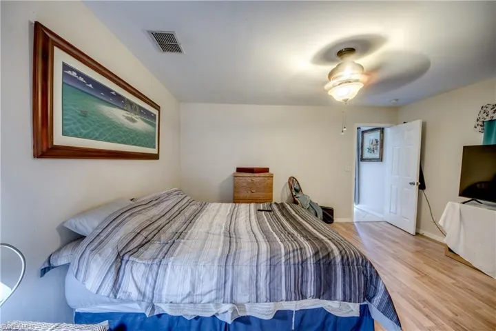 Bedroom featuring ceiling fan and wood finished floors