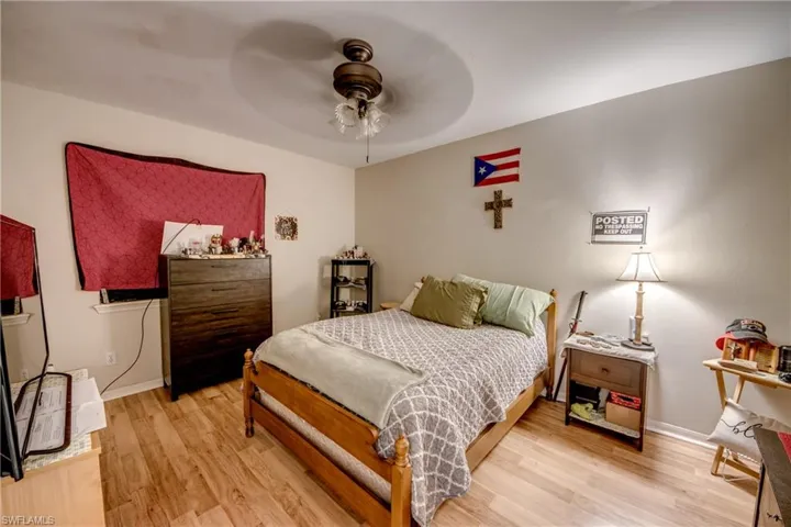 Bedroom with light wood-style flooring and ceiling fan