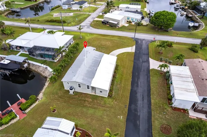 Aerial view of residential area featuring a large body of water