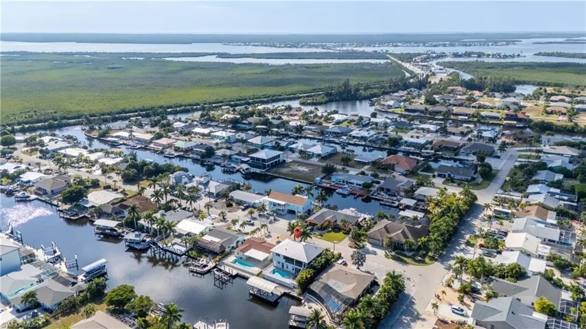 Aerial perspective of suburban area with a nearby body of water