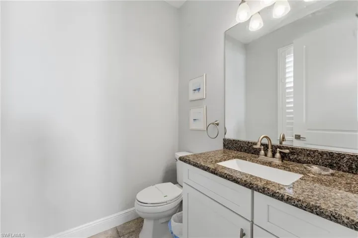 Bathroom featuring vanity and light tile patterned flooring