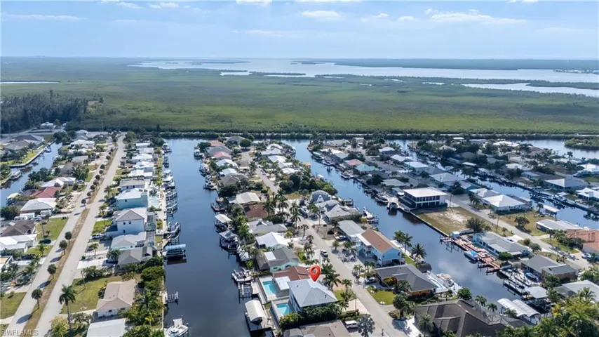 Aerial perspective of suburban area with a large body of water