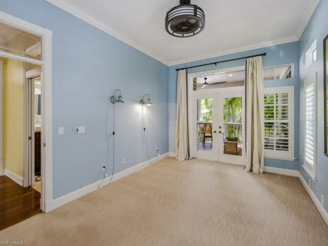 Bedroom with French Doors Leading to Back Lanai