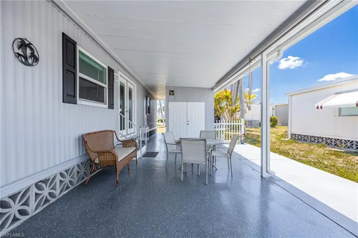 Sunroom / solarium featuring outdoor dining area