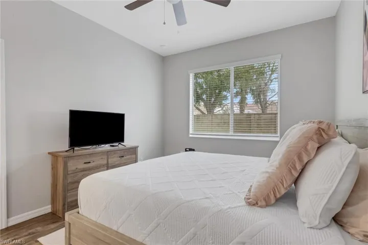 Bedroom featuring wood finished floors and a ceiling fan