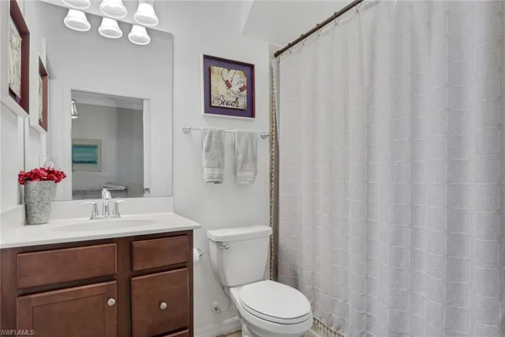 Full bath featuring vanity and a shower with curtain