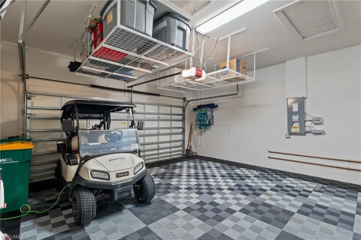 Garage with a garage door opener and electric panel