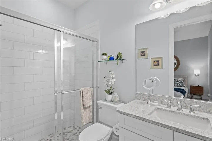 Ensuite bathroom with vanity and a shower stall