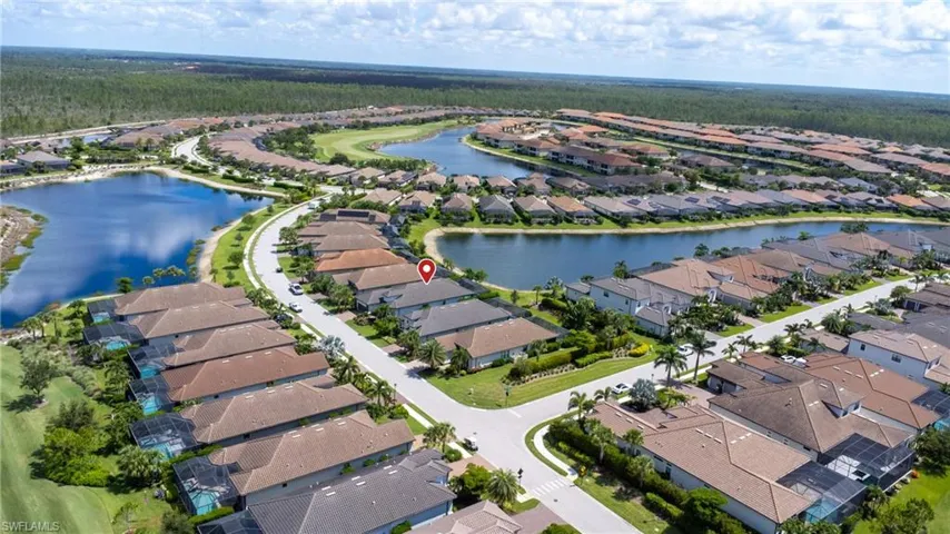 View of property location with nearby suburban area and a nearby body of water