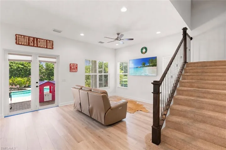 Bright interior space featuring light wood-finish flooring and white walls